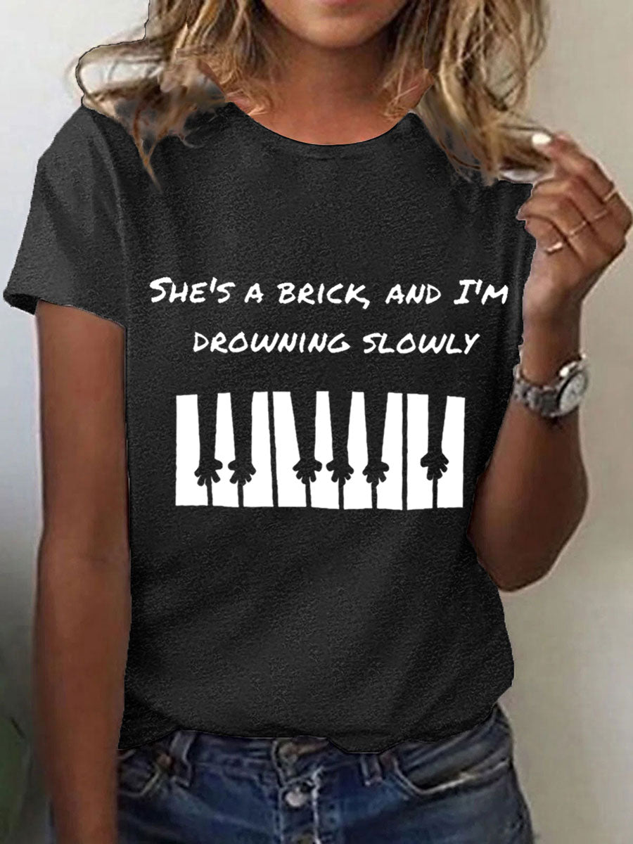 Women's She's a brick, and I'm drowning slowly lyrics T-shirt