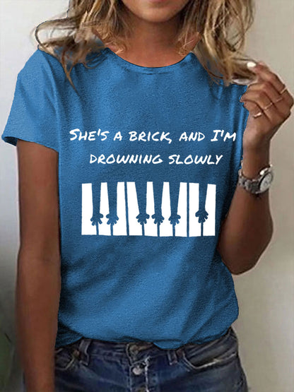 Women's She's a brick, and I'm drowning slowly lyrics T-shirt
