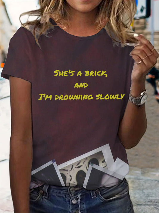 Women's She's a brick, and I'm drowning slowly lyrics T-shirt